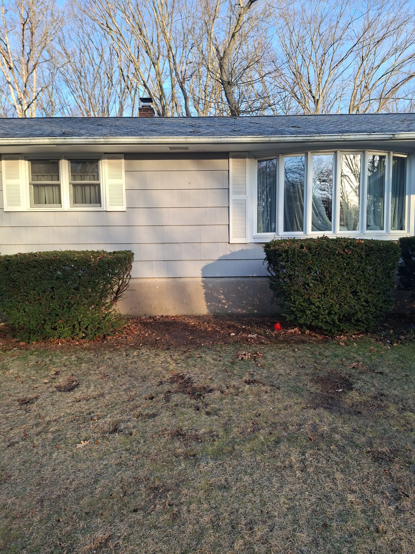 Before egress window installation in North Haven, Connecticut — exterior view
