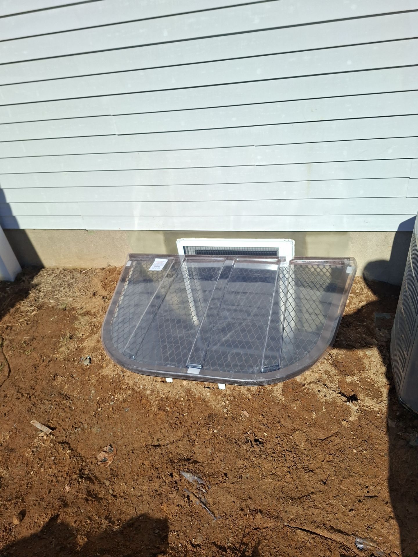 After egress window installation in Milford, Connecticut — exterior view