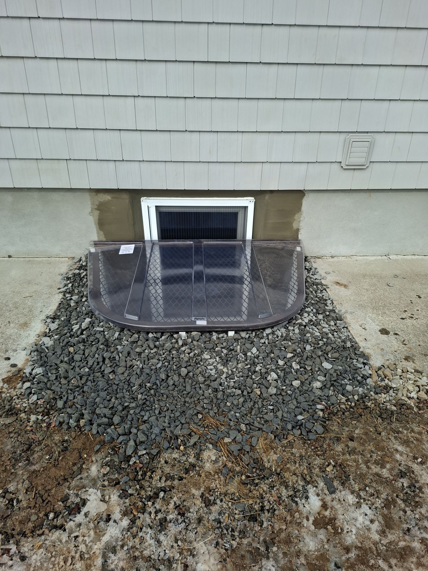 After egress window installation in Bridgeport, Connecticut — exterior view
