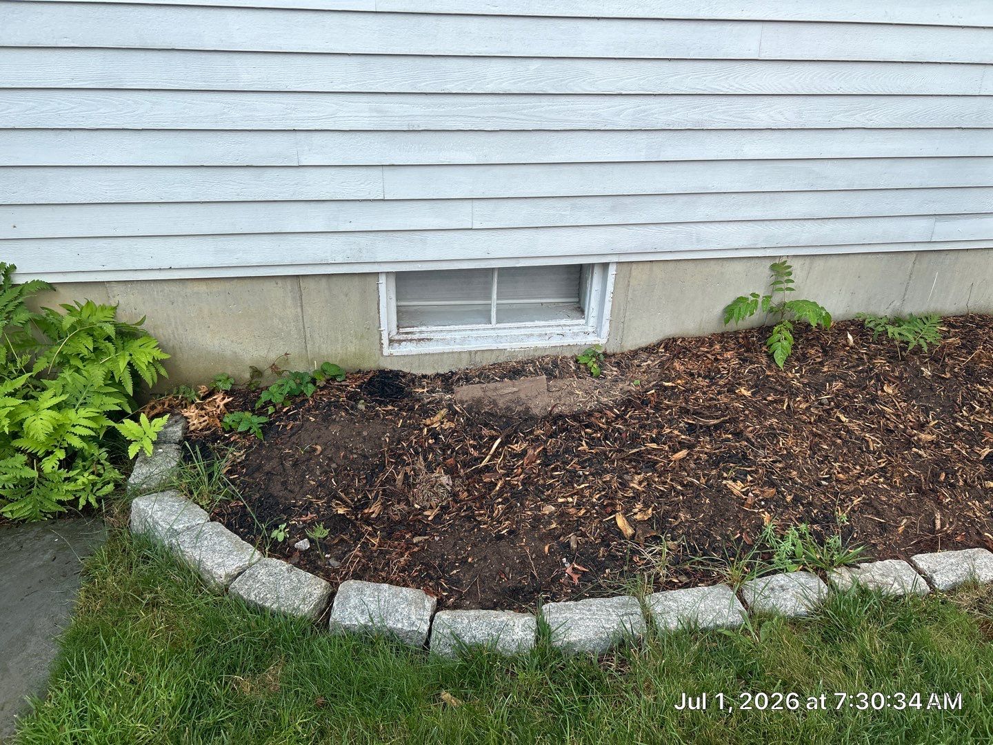 Before egress window installation in Fairfield, Connecticut — exterior view