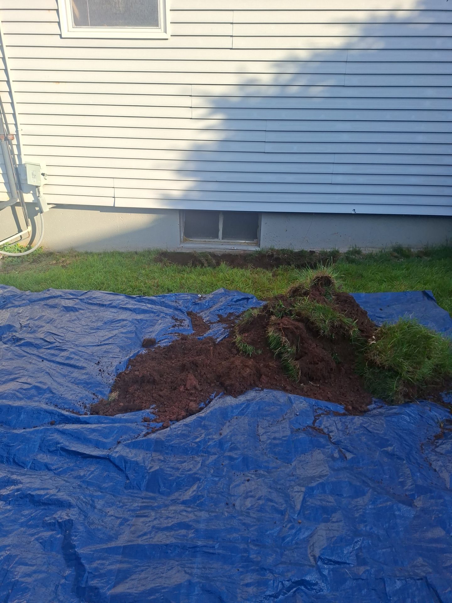 Before egress window installation in North Haven, Connecticut — exterior view