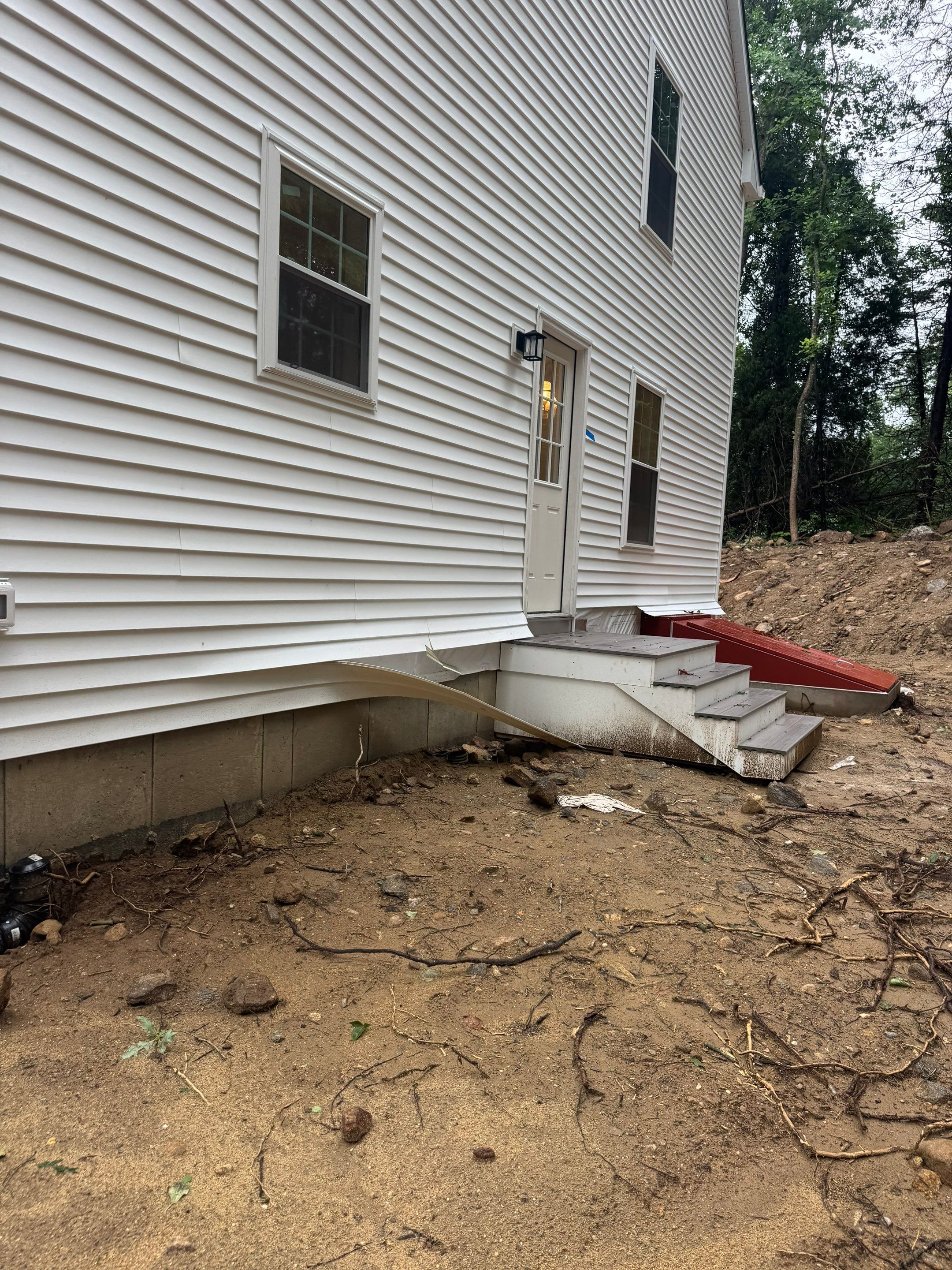 Before egress window installation in East Haddam, Connecticut — exterior view