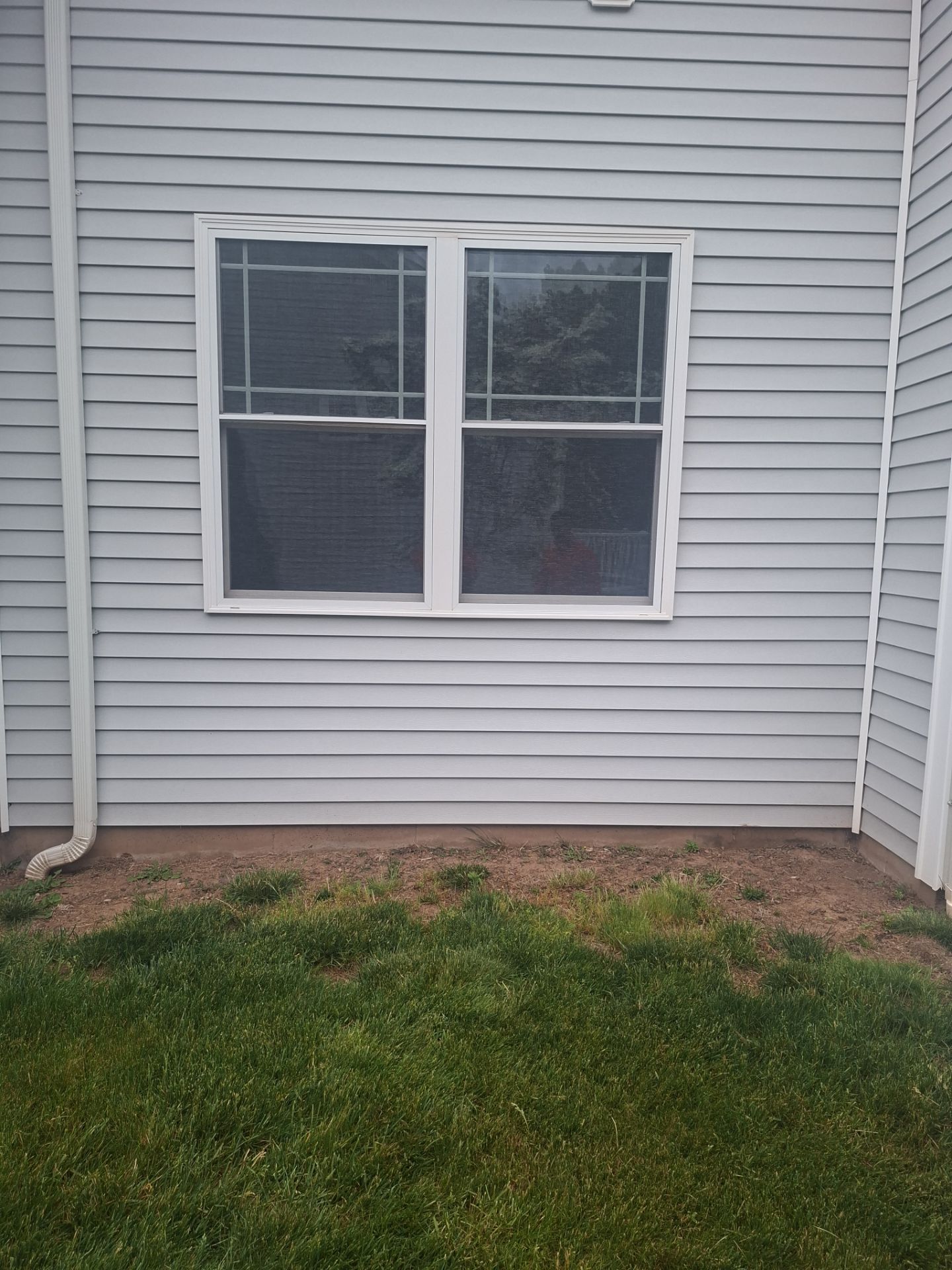 Before egress window installation in North Haven, Connecticut — exterior view