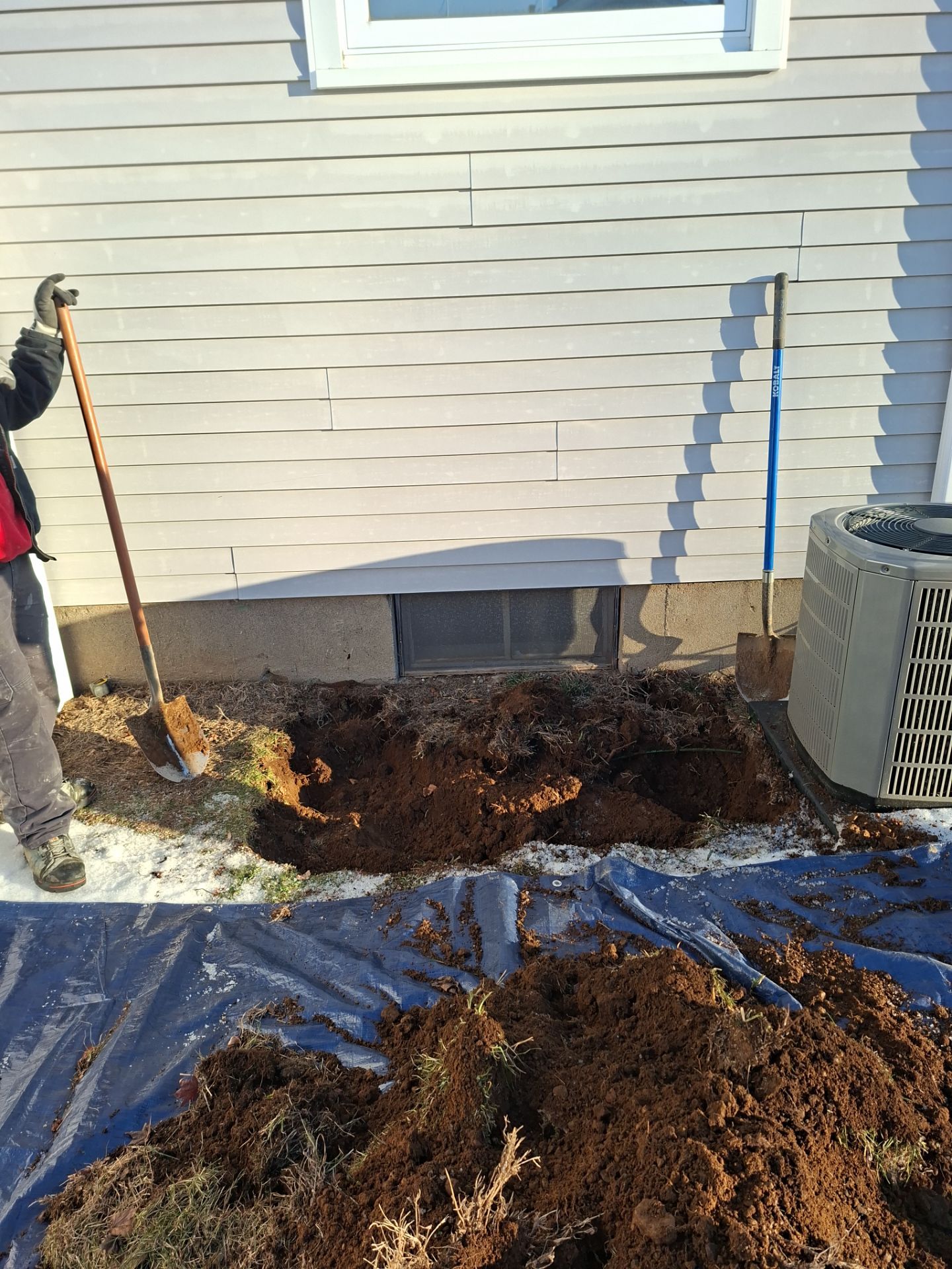 Before egress window installation in Milford, Connecticut — exterior view