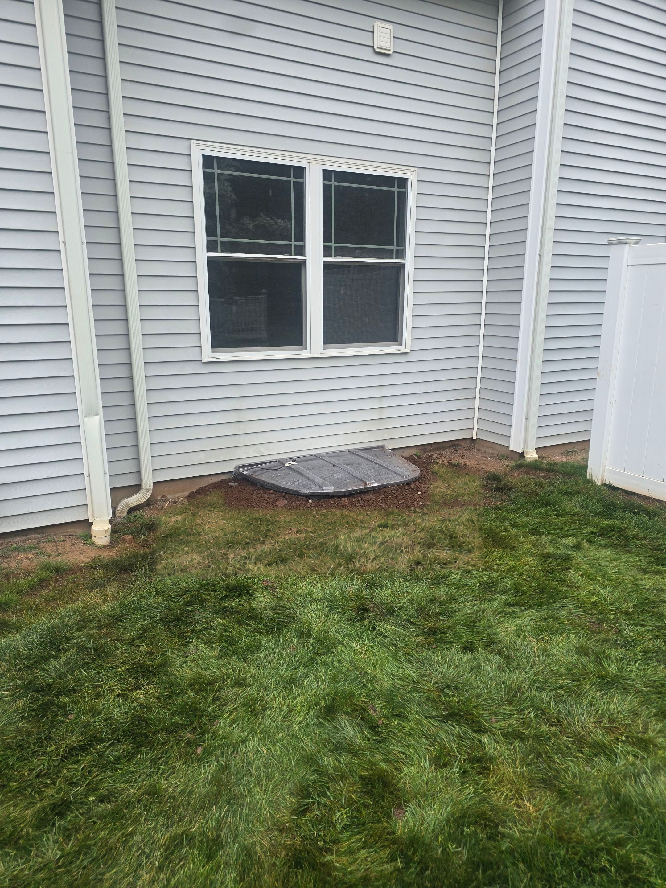After egress window installation in North Haven, Connecticut — exterior view